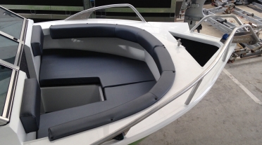 Bow of X-Bowrider, showing seating for multiple people and easy access to the anchor well
