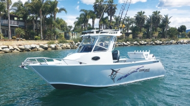 Tomahawk Offshore 700 Centre Cabin with Fixed Visor Hard Top on water