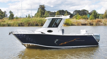 Tomahawk 660 Enclosed Hard Top Centre Cabin on river