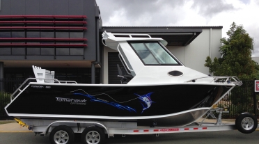 Tomahawk Offshore 660 Enclosed Hard Top trailered for pickup