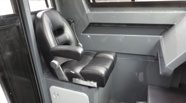 Passengers side seat, console and side pocket in custom half cabin
