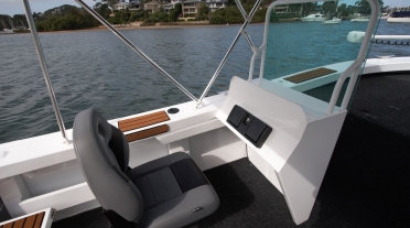 Passenger Console for Formosa Dual Side Console, smooth water is visible over the gunnel